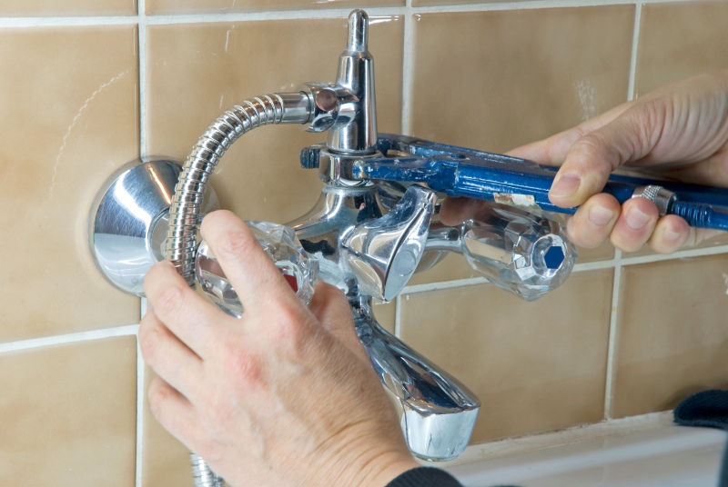 Shower being installed in a Thamesmead bathroom