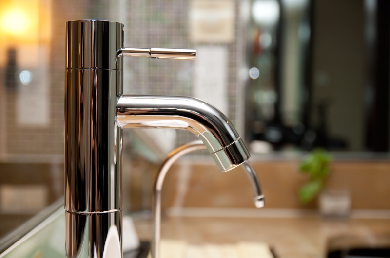 Leaking tap being repaired in Thamesmead